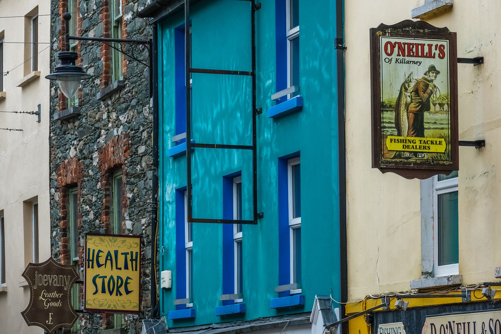 Limerick, Ireland -  April 2017 : Pubs, bars and shops signs in a town in Ireland